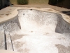 A pool with plaster chipped out 