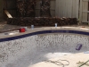 A pool chipped out with new tile installed
